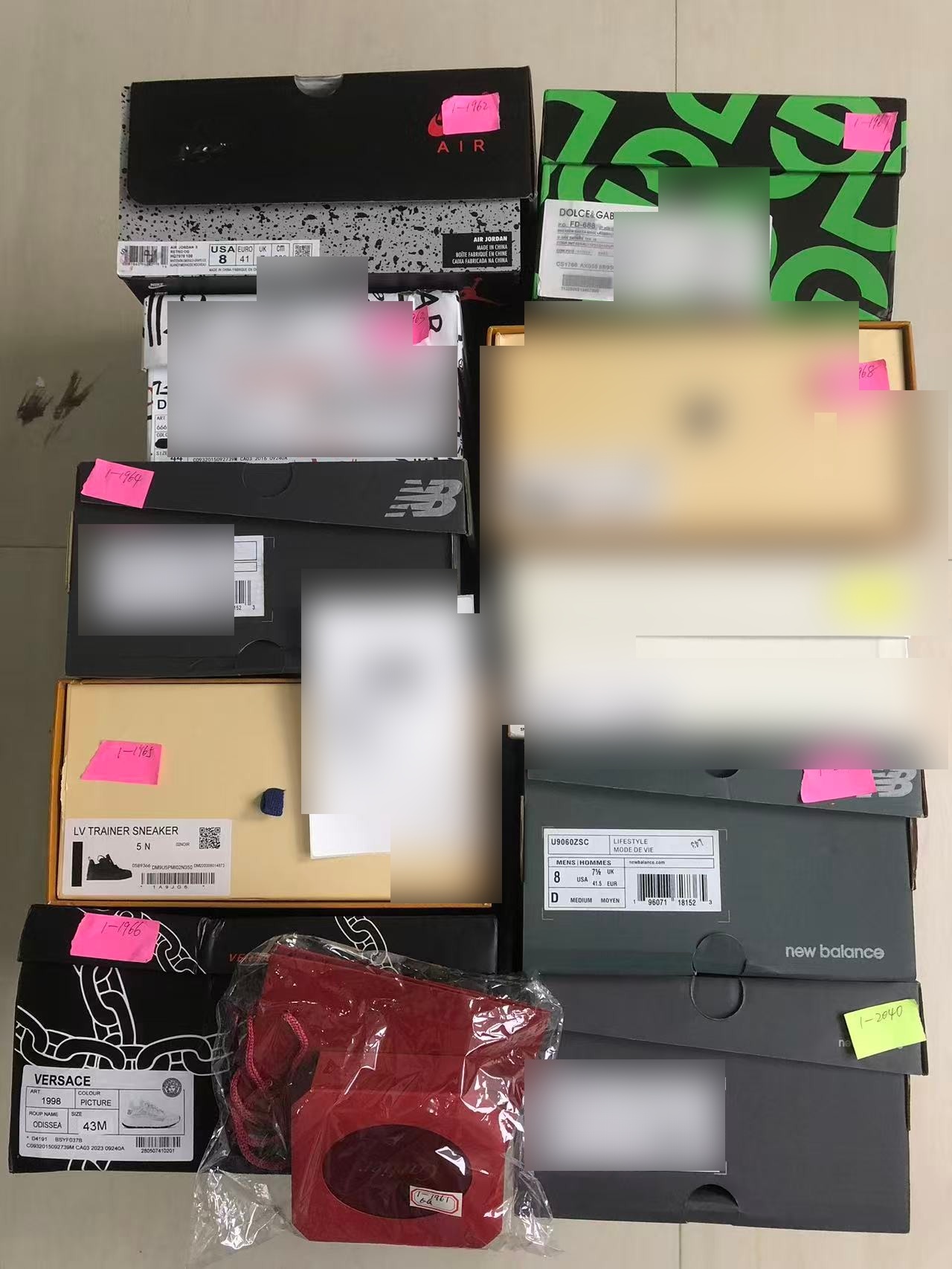 Multiple orders packed - sneakers and luxury boxes with shipping labels