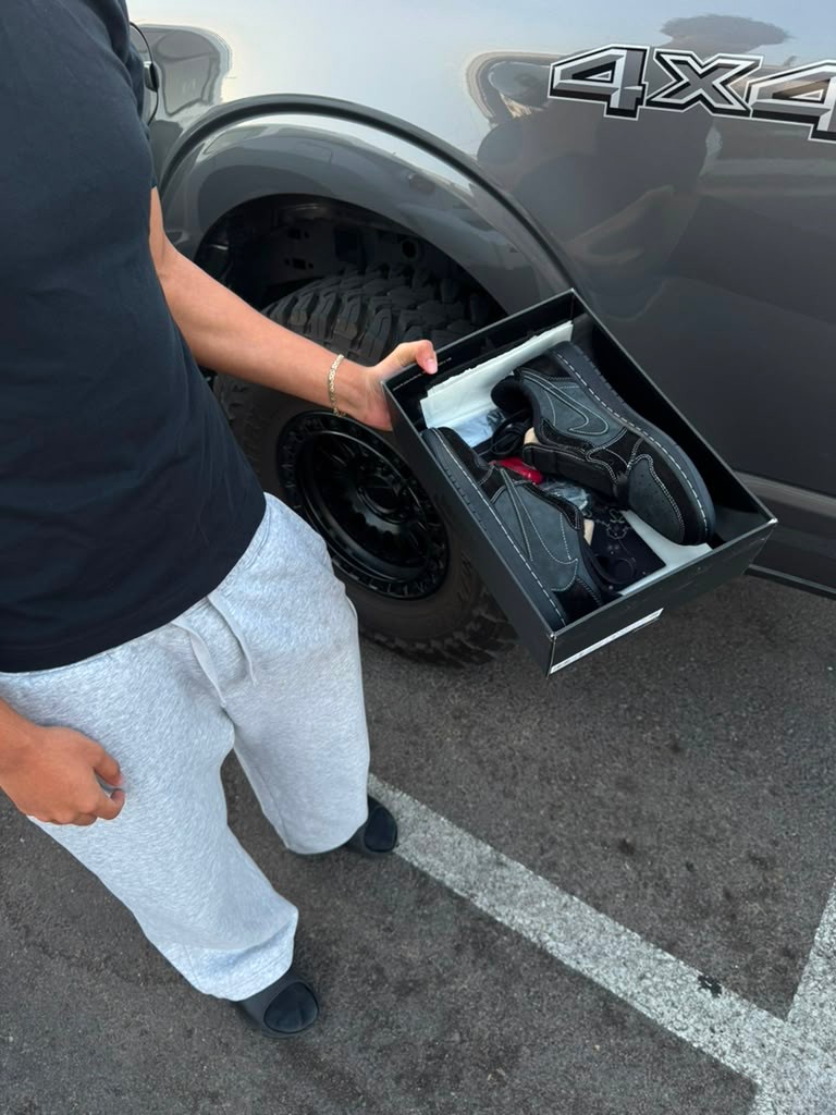 Customer opening black Phantom style box to inspect pair