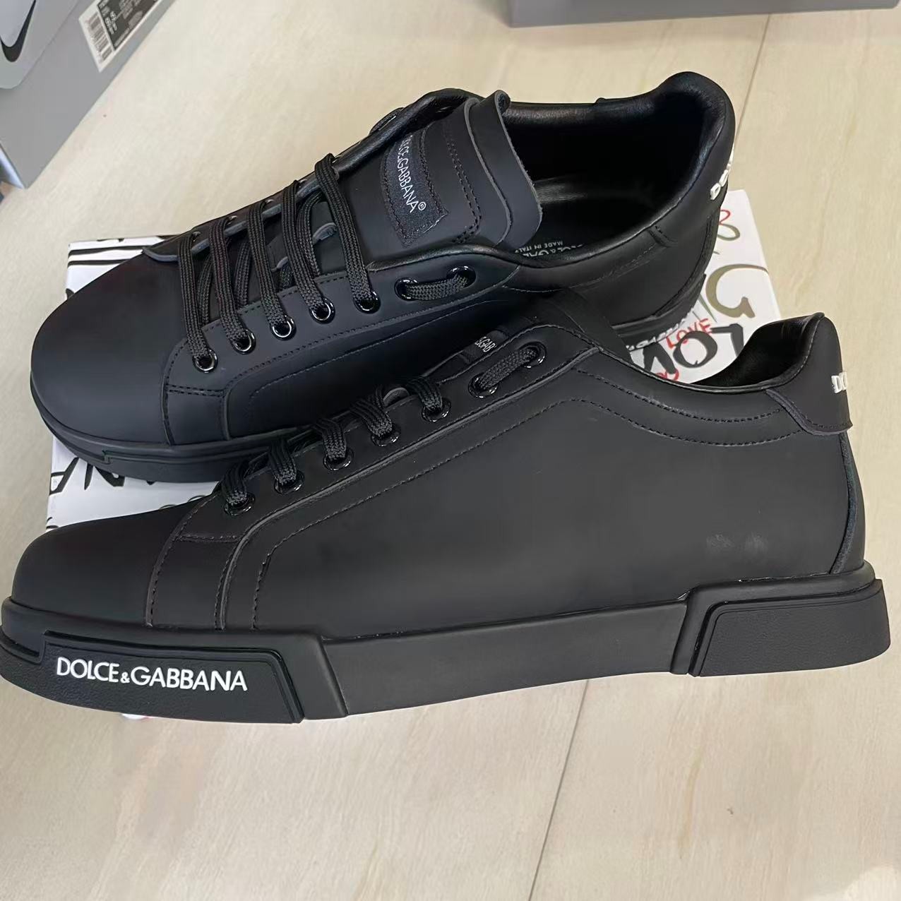 Dolce and Gabbana matte black leather low-top sneakers customer delivery proof