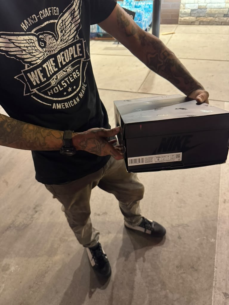 Customer holding delivered Nike box order proof