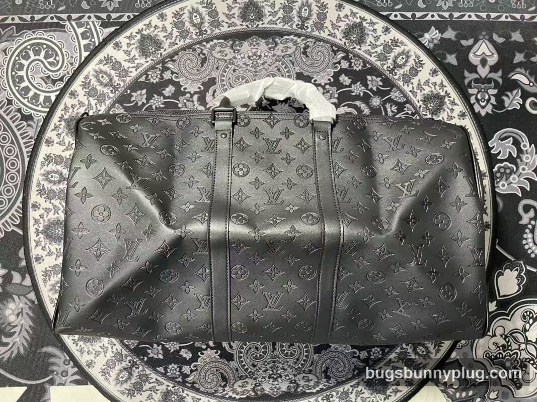 L&V monogram Keepall duffle bag QC photo — full front view with embossed monogram