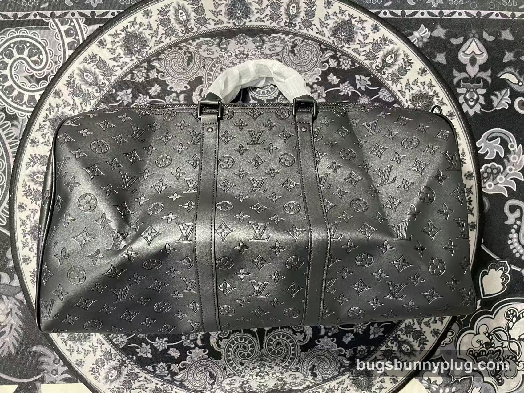L&V monogram Keepall duffle bag QC photo, side profile with leather trim